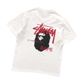 Camiseta Bape × Stussy "By A Bathing Ape"